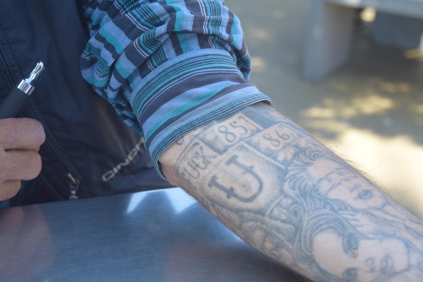 tattooed hands